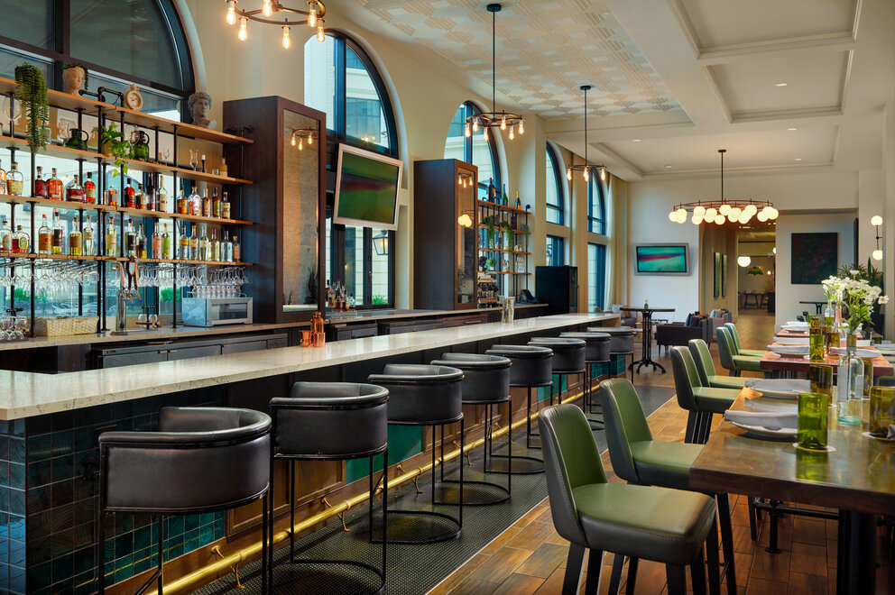 a bar with chairs and tables